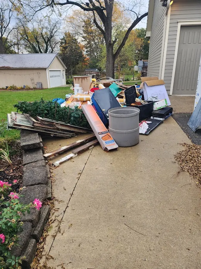 Dumpster being loaded with debris for 3 Yard Dumpster Rental in Makawao